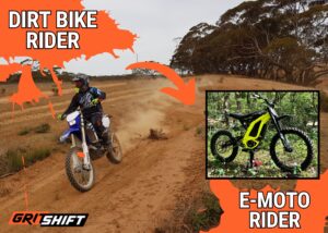 a dirt bike rider with a picture of an emoto