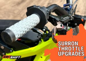 A close up image of a throttle and grip on a Surron