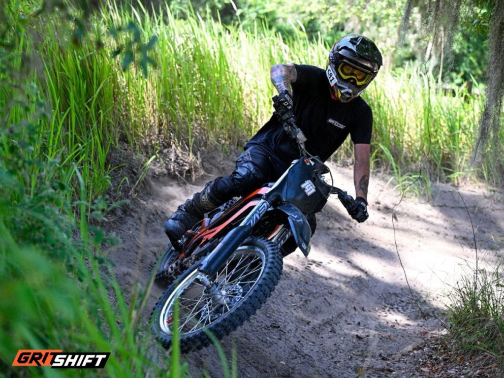A rider on the E Ride Pro electric dirt bike