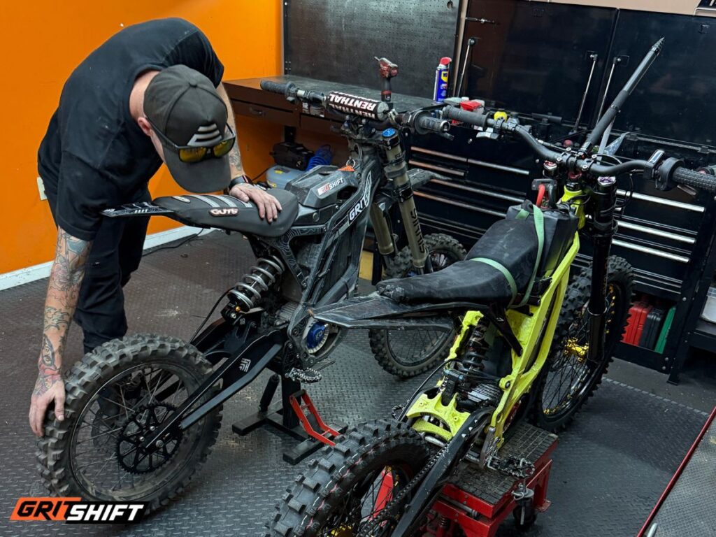 Rusty working on a Surron with the R&D team