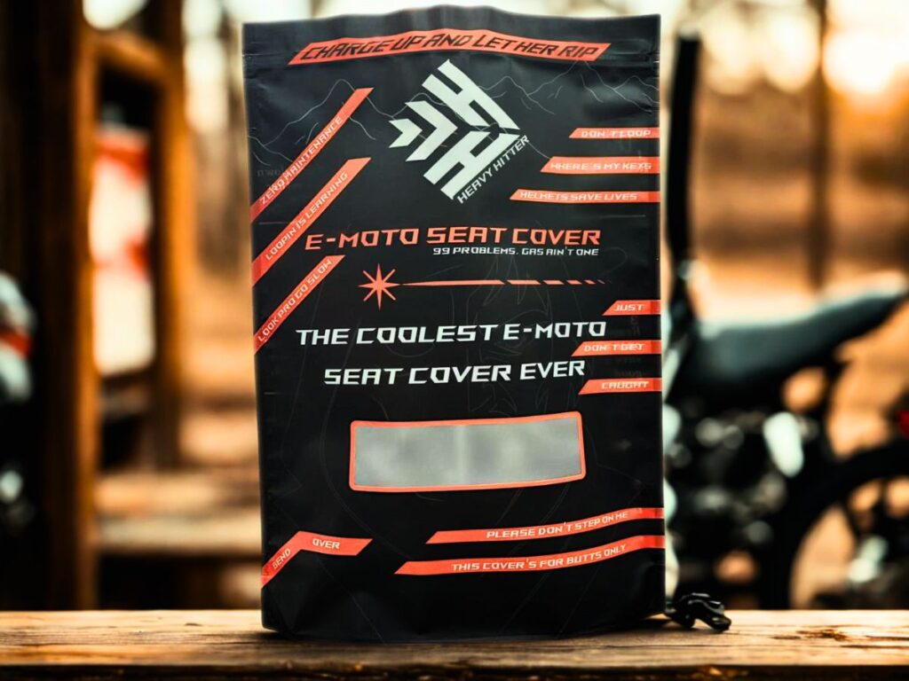 An image of the packaging for a Guts Seat Cover 