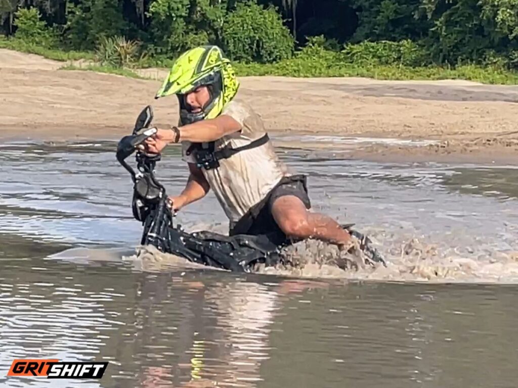 A rider on the SurronSki testing it on a lake.