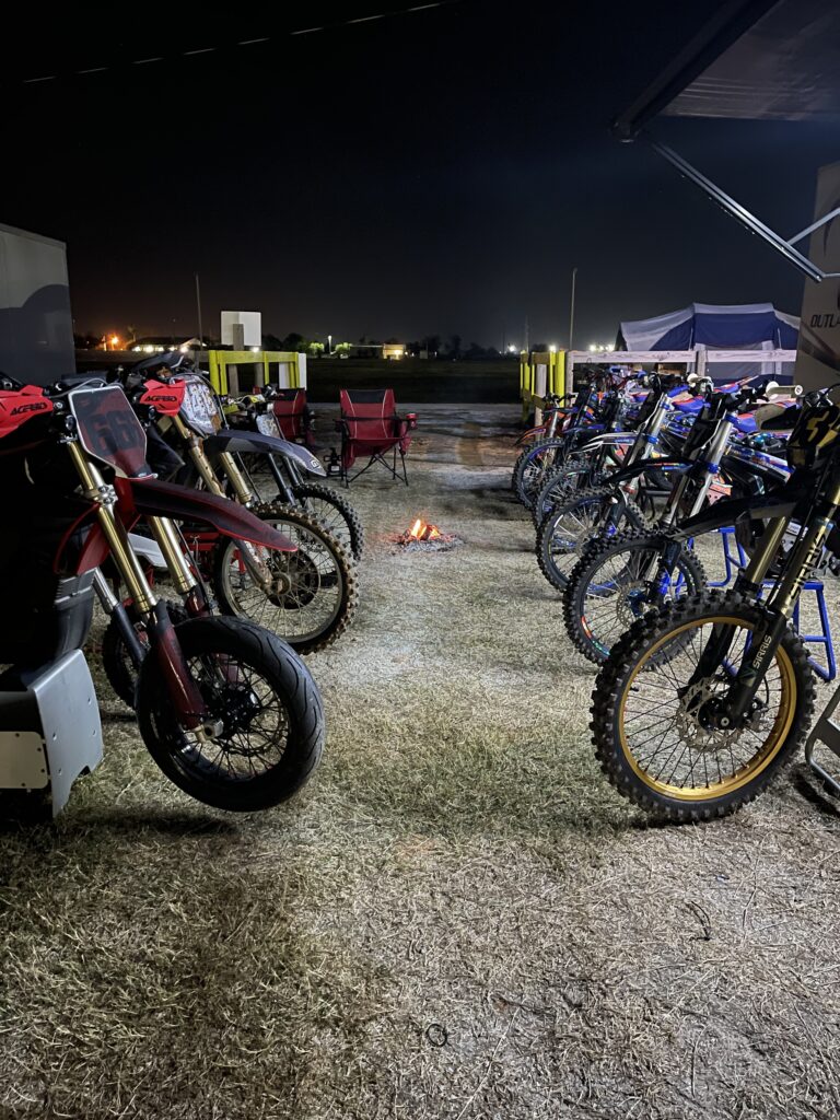 A group of electric dirt bikes at night time