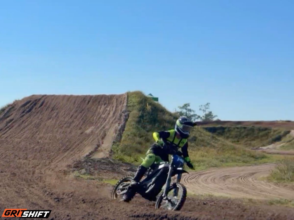 A rider on an MX track on the E Ride Pro SR 