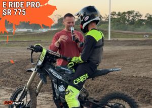 a rider being interviewed post race on the E Ride Pro SR