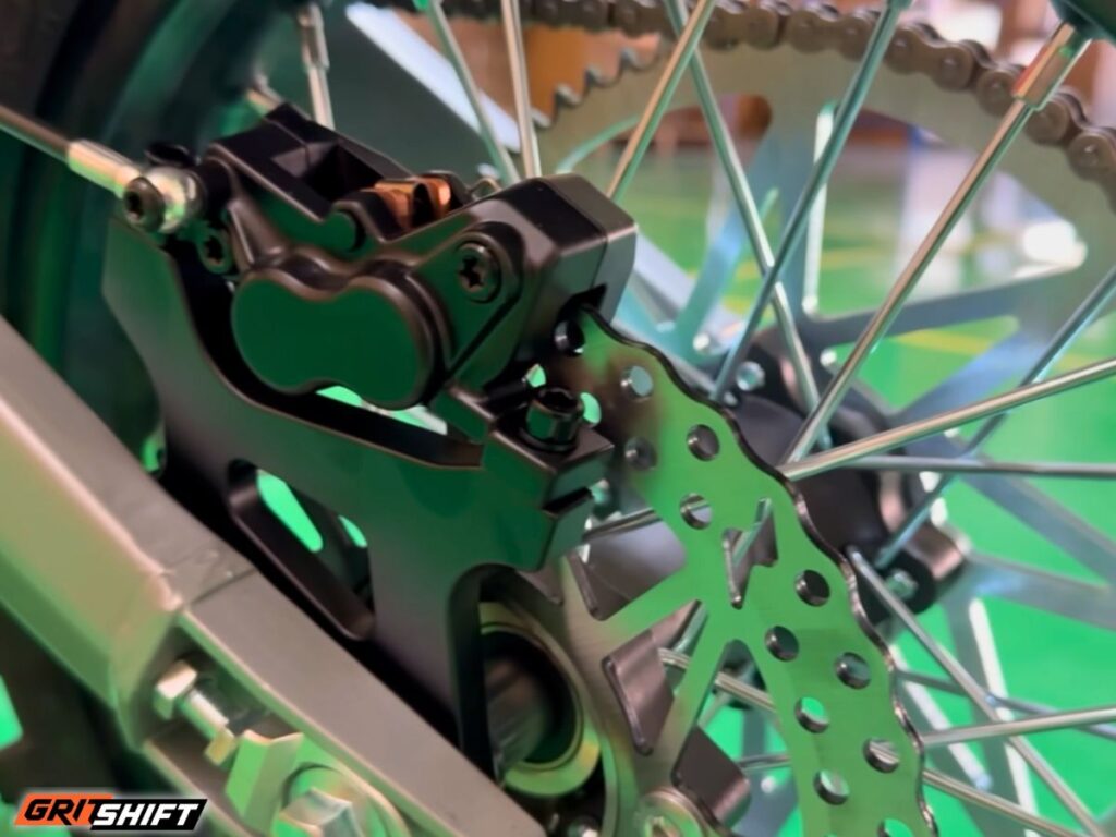 Close up of the rear brake caliper and tire of the ETM RTR XL. 