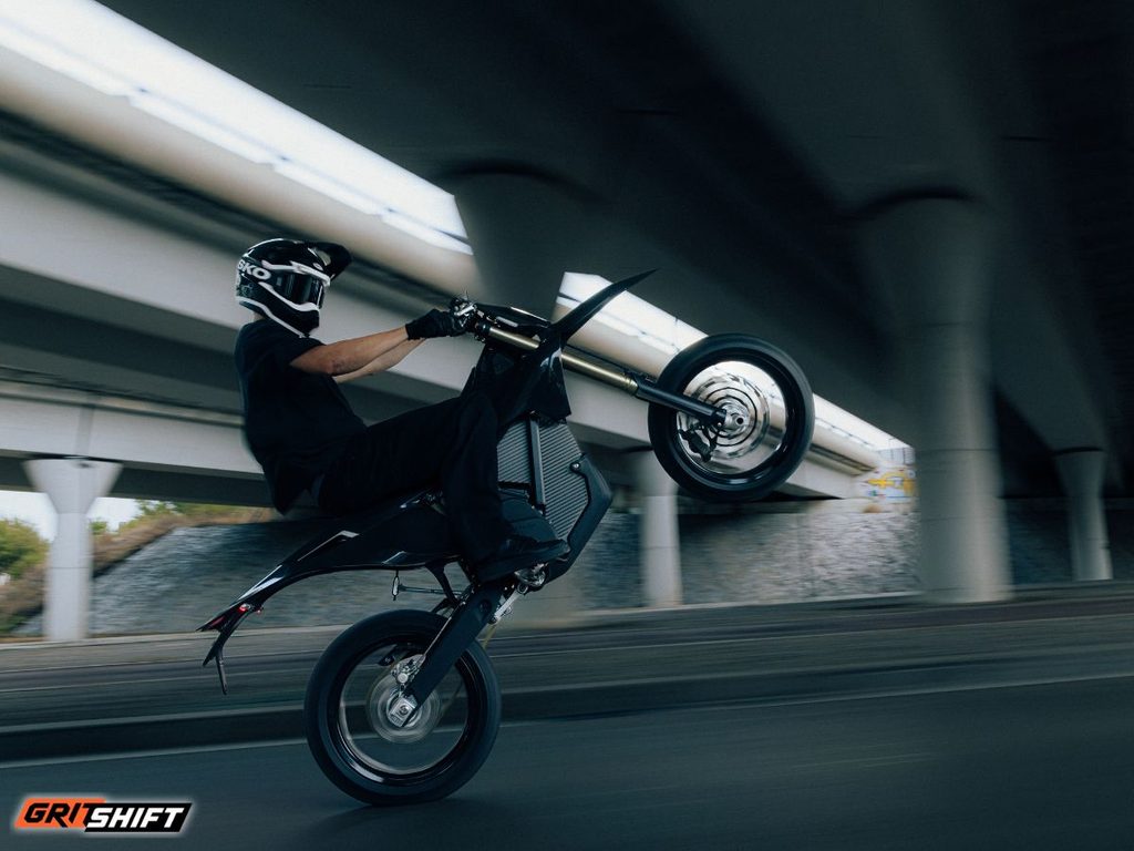 A rider doing a wheelie on the Stark Varg Skoll